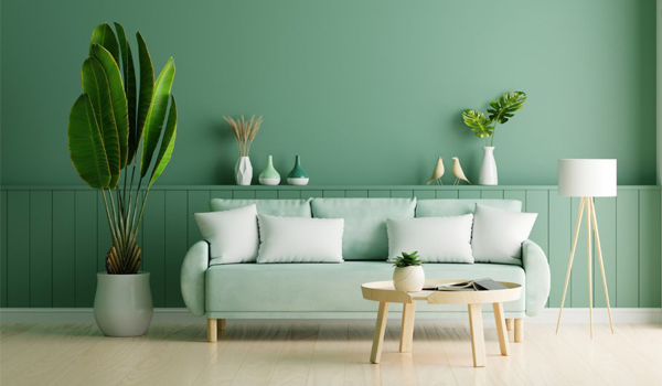 Ghế sofa xanh lá cây là màu đại diện cho hành Mộc, tương sinh với Hỏa